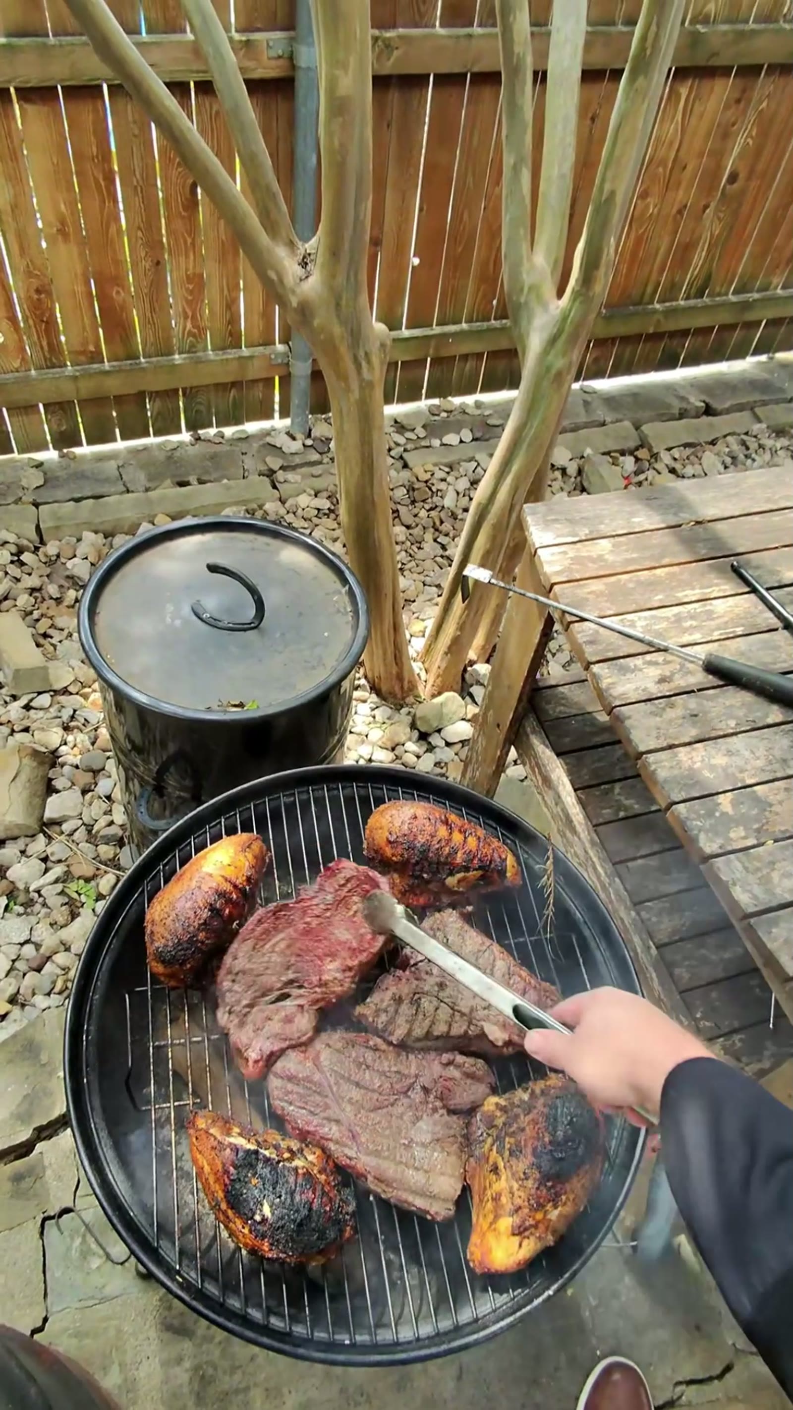 Cubes of caramelized brisket burnt ends over a charcoal grill