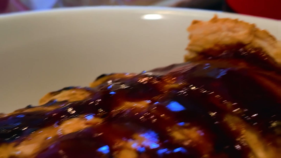 Close-up of glossy sauced ribs on a grill