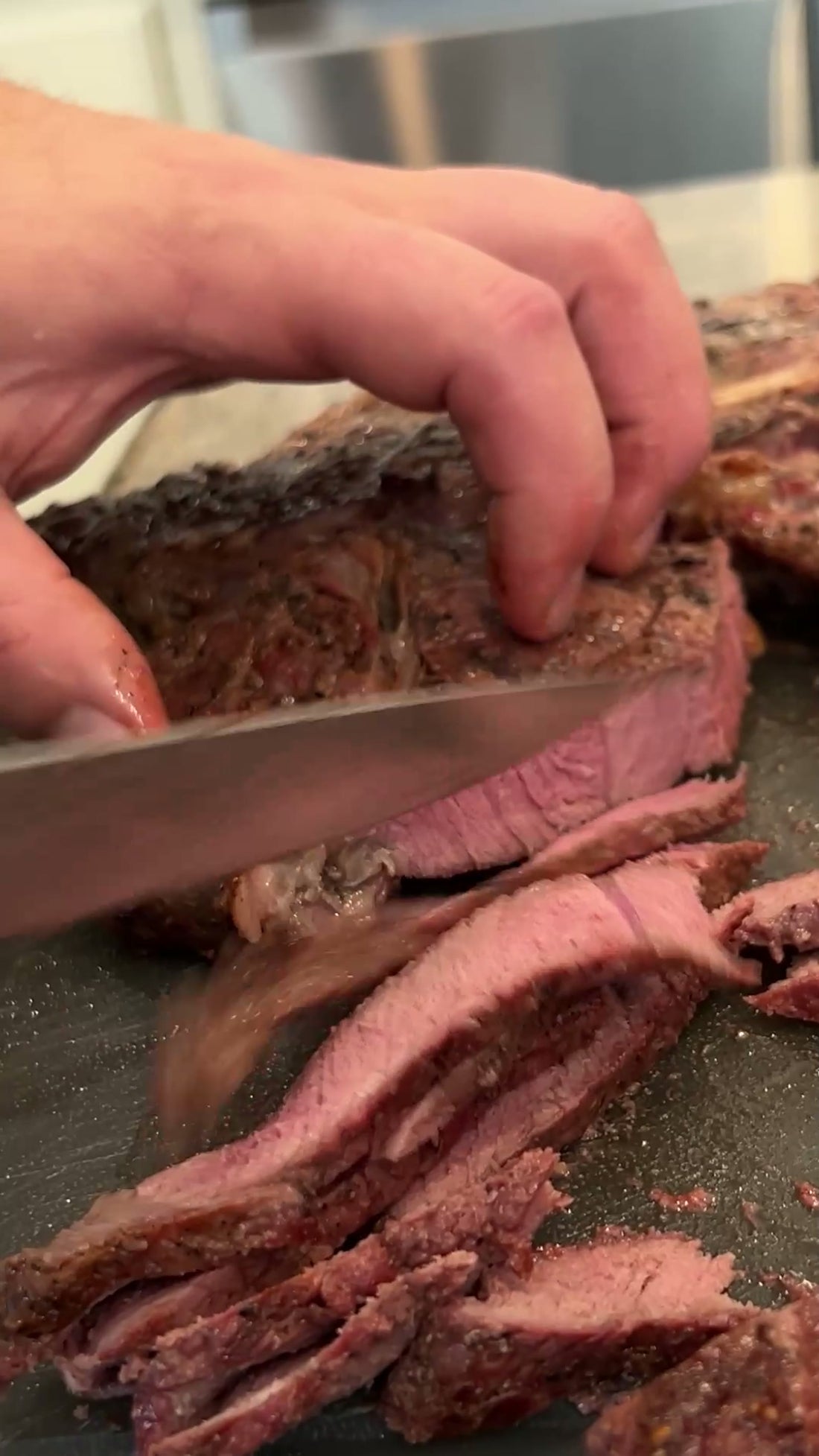 Sliced brisket on a cutting board